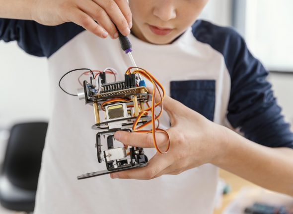 close-up-child-making-robots